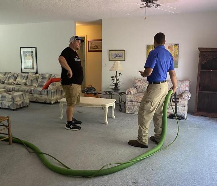 SERVPRO crew cleaning a carpet