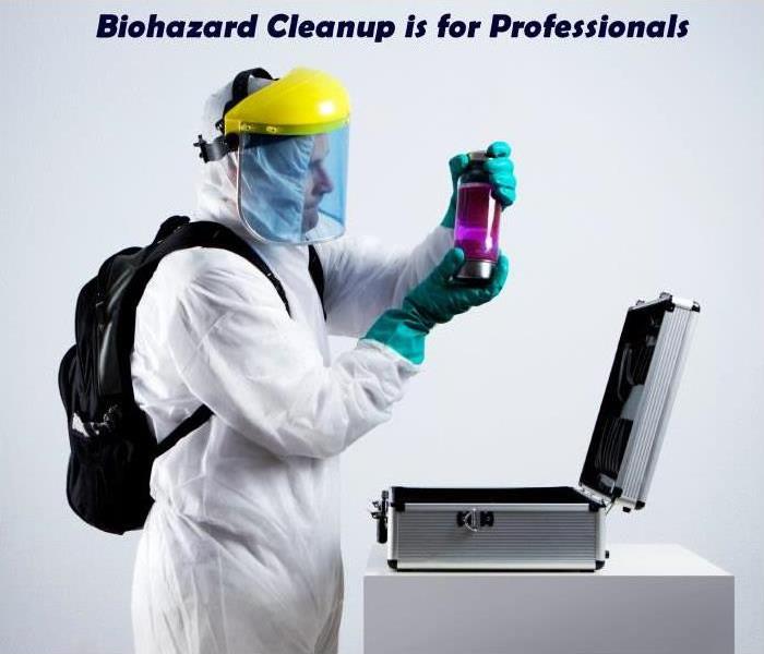 SERVPRO technician in biohazard protective wear with text that says bio hazard is professionals  