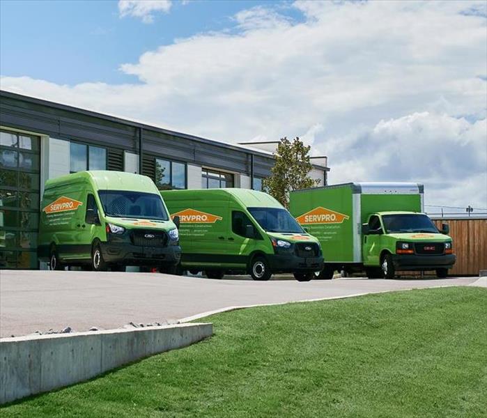 Our SERVPRO trucks are pictured here outside of a building. 