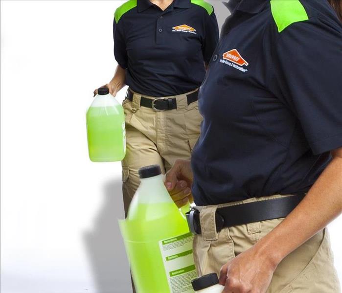 SERVPRO female technicians with cleaning products