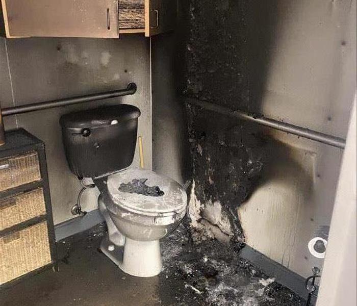 Fire damage in an employee bathroom after a fire